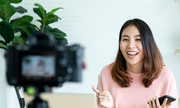 young woman making a piece to camera for influencer marketing or social media